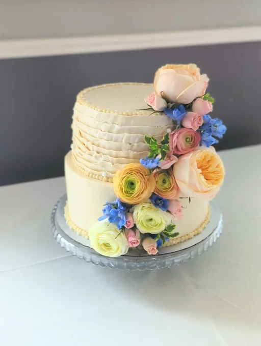 Floral wedding cake on cake stand