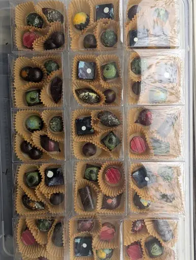 Small wedding favour boxes filled with assorted chocolates